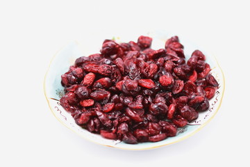 dried cranberry in a  porcelain plate