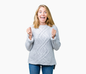 Beautiful young woman wearing winter sweater over isolated background celebrating surprised and amazed for success with arms raised and open eyes. Winner concept.