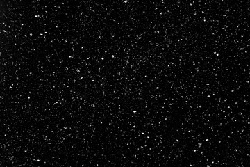 Real snow falling in a winter night. White snow on black background. Abstract elements to use in...