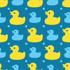 Seamless pattern with yellow rubber ducks on a blue background