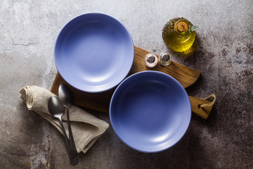 empty plates on the table, table setting for dinner or lunch. stylish kitchenware