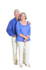 portrait of senior couple hugging on white background