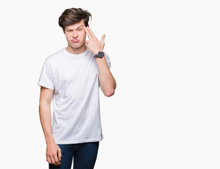 Young handsome man wearing casual white t-shirt over isolated background Shooting and killing...