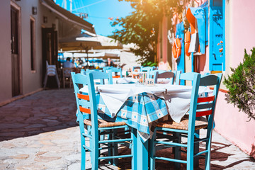 Outside traditional blue and white restaurant, greek tavern concept vacation in Greece
