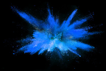 Explosion of colored powder on black background