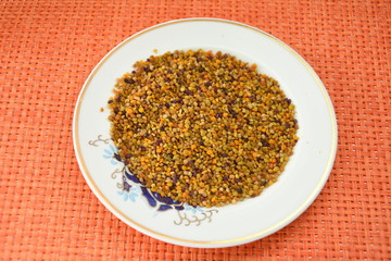  bee pollen  in a porcelain dish