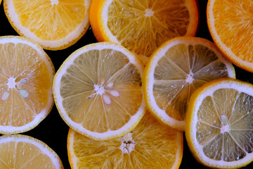 citrus slices on a black background