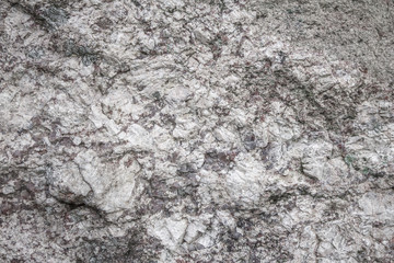 Gray rough texture of natural stone. Horizontal gray background. Suitable for design.