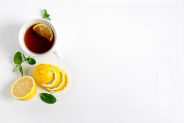 Background for banner with lemon mint and black tea seagull. Black tea with lemon. Background for banner with tea and lemon. Vitamin C Tea. Cold tea