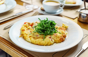 omelet with arugula salad in the restaurant