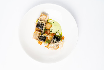 plate with delicious grilled mackerel with vegetables and green pea puree