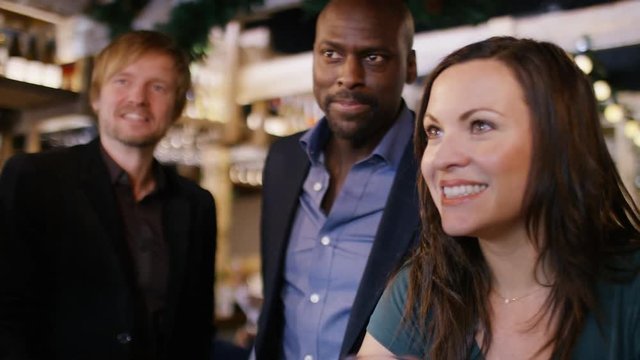 Two men get rebuffed in a bar by two females 