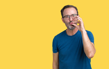 Handsome middle age hoary senior man wearin glasses over isolated background mouth and lips shut as...