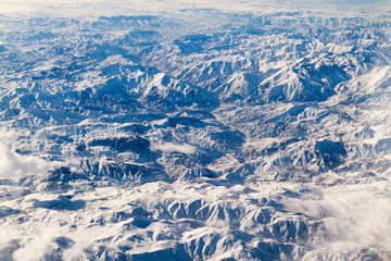 Fototapeta na wymiar Aerial view of snow covered mountains in northeastern Iran