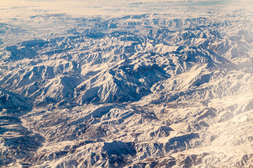 Naklejka premium Aerial view of snow covered mountains in northeastern Iran