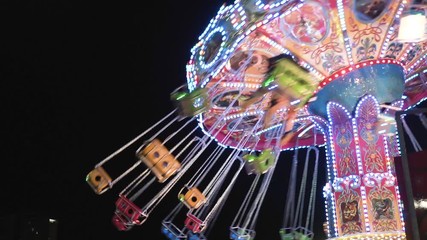 Colorful carousel at night in a park