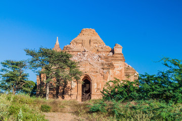 Dilapidated temple with a Buddha statue inside in bagan, Myanmar