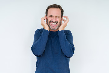 Elegant senior man over isolated background covering ears with fingers with annoyed expression for...