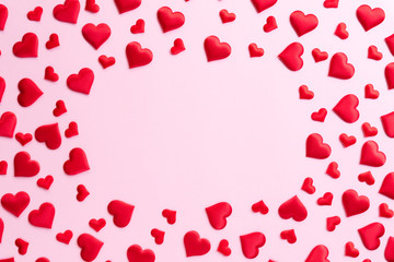 Valentines day and love concept. Red hearts background on pink.