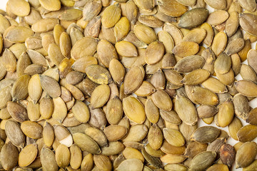 Scattered brown flax seeds background