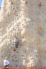 Man on Rock Climbing Wall