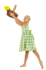 Cute little girl with a basket of flowers.