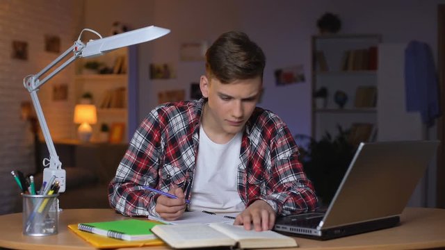 Confused teen student having difficulties with math assignment, test preparation