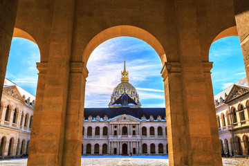 Main courtyard of Les Invalides (National Residence of Invalids) in Paris. Facade of church. French baroque architecture. Museums and monuments, military history of France. - obrazy, fototapety, plakaty