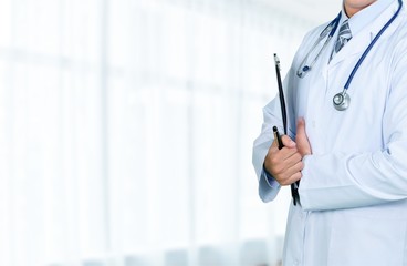 Young man doctor holding stethoscope