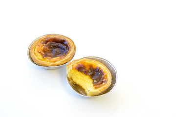 Two pieces of egg tart isolated on white background,Traditional Portuguese  sweet dessert with egg tart and custard cream.