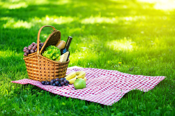 Picnic basket in summer park