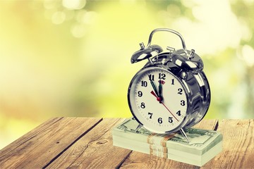 Retro alarm clock on table  background