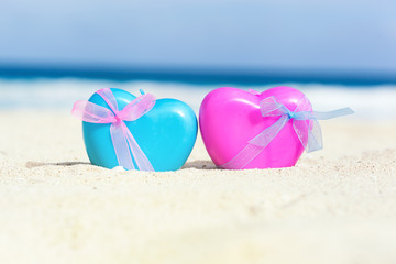 Valentines day card, hearts on beach
