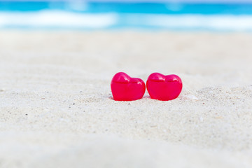 Valentines day card, hearts on beach