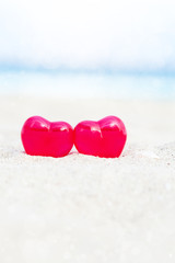 Fototapeta premium Valentines day card, hearts on beach