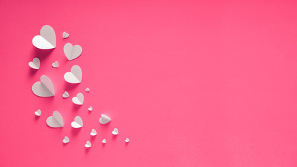 WHITE HEARTS OF PAPER ON PINK BACKGROUND FOR HAPPY SAN VALENTINE DAY