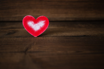 Fototapeta premium red heart on wooden background. Valentine's Day. celebration