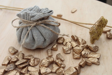 Cotton bag full of gold symbolizing richness and prosperity