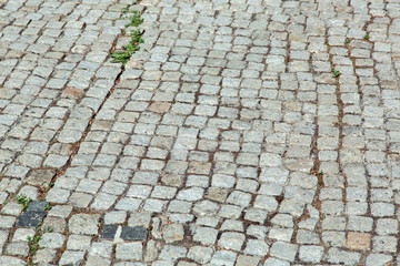 square pebble stone blocks of gray color, tile pavement texture.