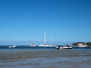 Unrecognizable tourists having fun on excursion on party boat