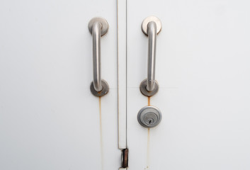 double steel door handle on metal door for lock or secrete concept