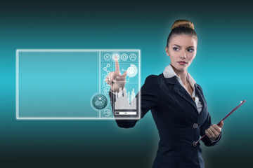 Young business lady works with virtual graphic interface in futuristic office