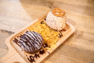 vanilla ice cream with chocolate lava  and Cereal on wooden table