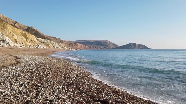Walking along Worbarrow Beach on the Jurassic Coast in Dorset.