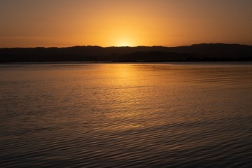 Naklejka premium sunset over estuary