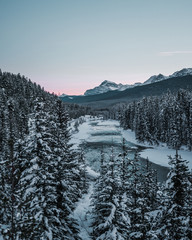 Morant's Curve with train in winter, Banff National Park, AB, Canada