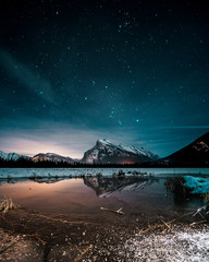 Beautiful night full of stars above Mt Rundle, Vermilion Lakes and Banff town, Banff National Park,...