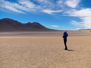 Tourist in the high altitude desert, Bolivia