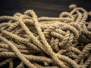 Fototapeta na wymiar Pile of worn cotton rope with whipped ends