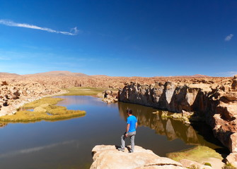 Tourist at Laguna escondida in Sur Lipez, Bolivia